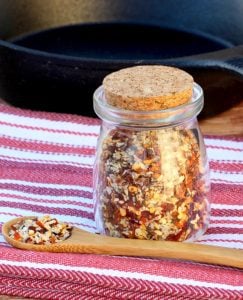Corked jar of stead seasoning.