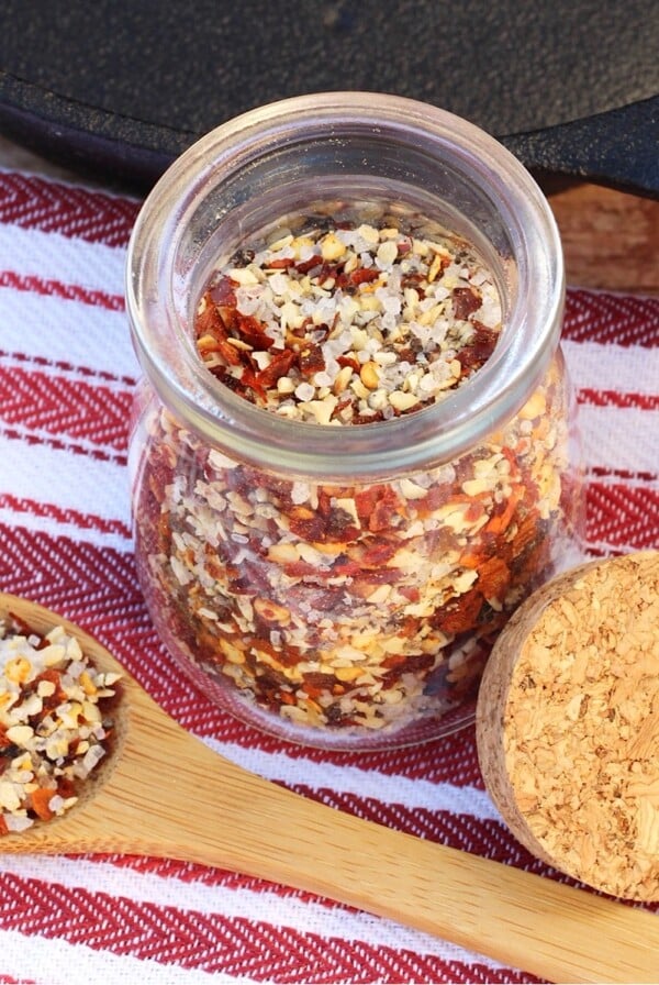 Steak Seasoning in small jar and on a spoon.