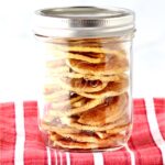 Apple chips stacked in a mason jar.