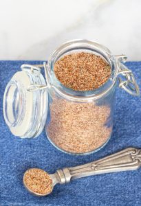 Open jar of chili seasoning.
