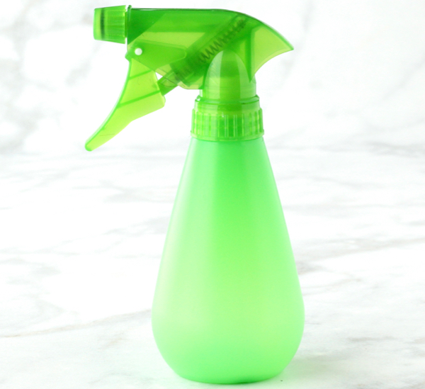 Green spray bottle.