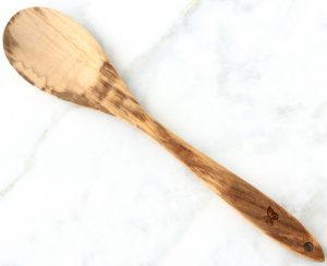 Wooden spoon on a marbled surface.