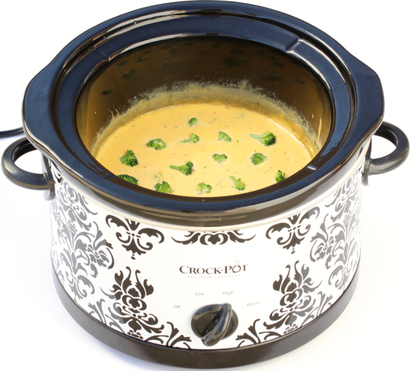 Cheese dip in black and white slow cooker.