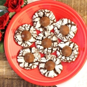 Chocolate Kiss Thumbprint Cookies on a red plate.