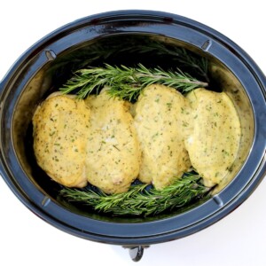 Cooked Chicken with creamy Italian sauce in slow cooker.