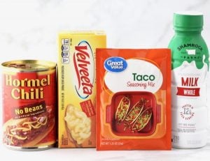 Queso ingredients including taco seasoning, Velveeta, and milk.