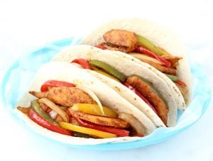 Chicken fajitas on a plate.