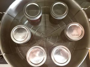 Jars of Blackberry Jam in a water bath.