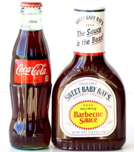 Bottles of Coke and barbecue sauce.