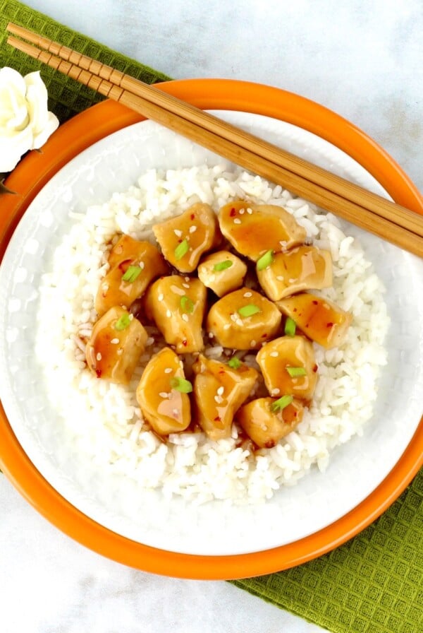 Plate of orange chicken on rice.