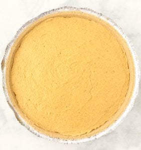 Pumpkin mixture in a pie crust.