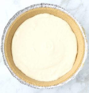Cream cheese mixture in a pie crust.