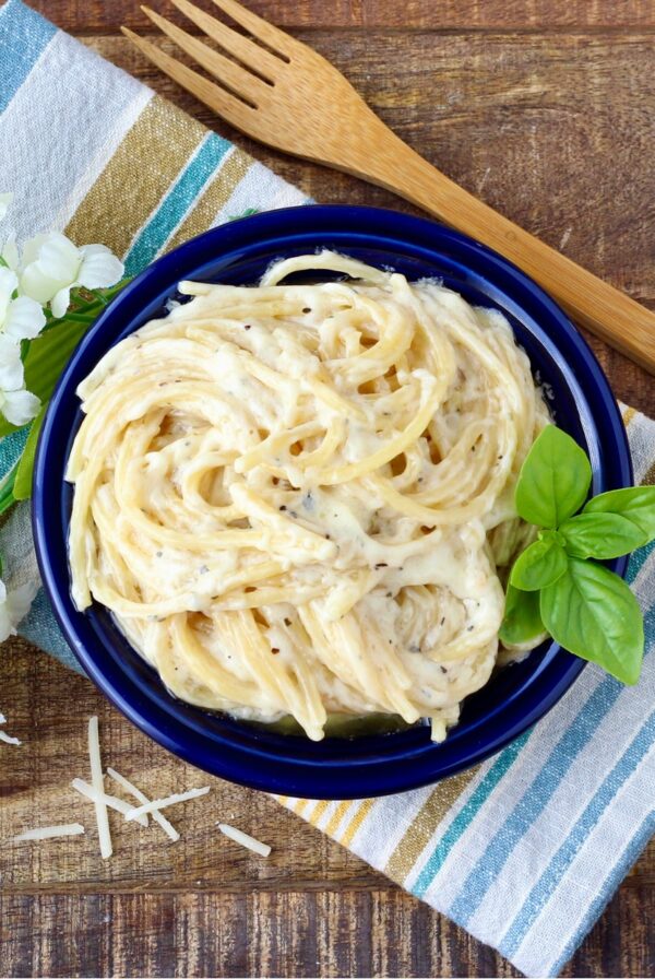 Garlic Parmesan Pasta in blue dish with fork to the side.
