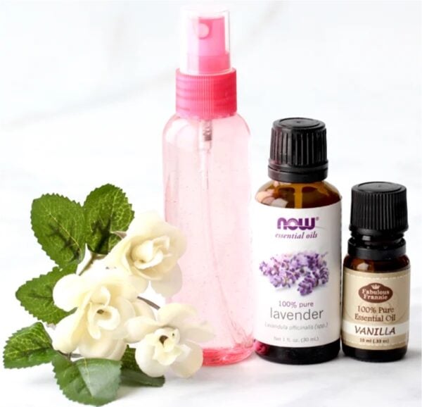Small spray bottle with lavender and vanilla essential oils to the side.