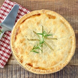 Double crust chicken pot pie with pie server.