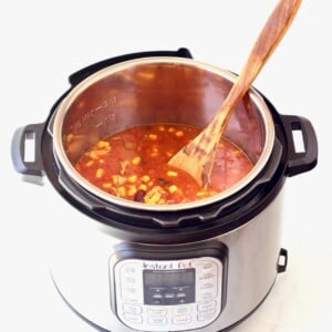 Instant Pot of Tortilla Soup with a wooden spoon.