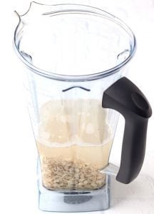 Oats, water, and flavorings in a blender.
