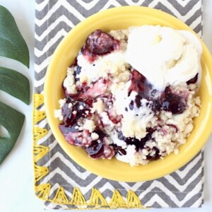 Yellow bowl of Berry Cheesecake Cobbler.