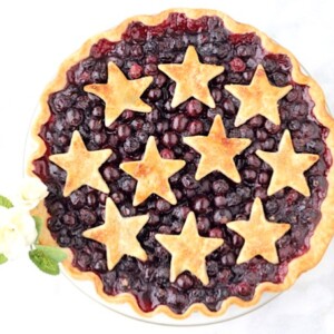 Star-shared crust on a blueberry pie.