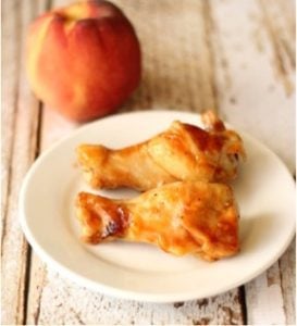 Peach chipotle chicken wings on a plate.