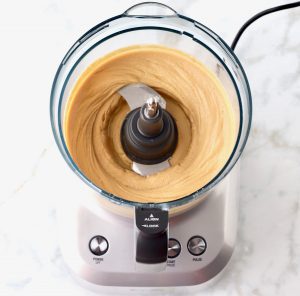Food processor of blended peanuts.