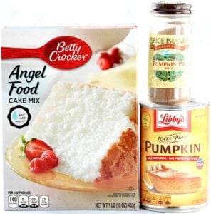 Containers of angel food cake mix, pumpkin pie spice, and pumpkin puree.