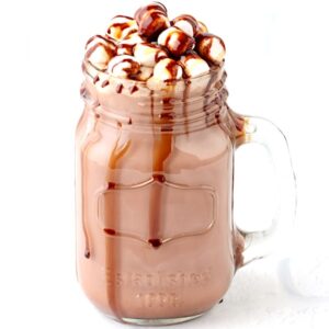Hot chocolate in jar mug with marshmallows and chocolate syrup drizzled on top.