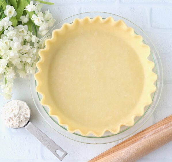 Empty pie crust in a pie pan.