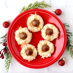 Hershey Kiss cookies with coconut on plate.