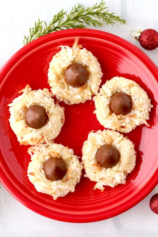 Hershey Kiss cookies with coconut on plate.