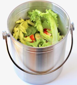 Vegetable trimmings in a pail.