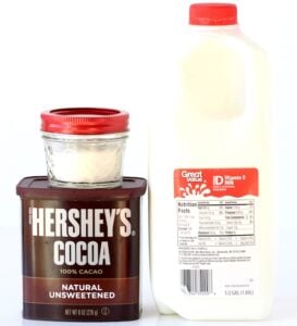 Containers of cocoa powder, sugar, and milk.