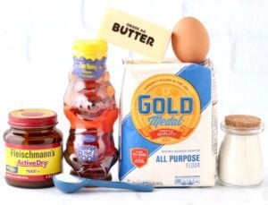 Hamburger bun ingredients including honey, flour, and butter.
