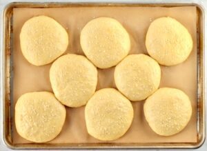 Discs of dough topped with sesame seeds.