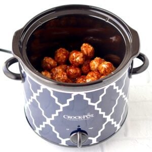 Orange meatballs in a Crock Pot.