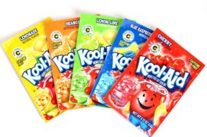 Several containers of different-flavored Kool-Aid.