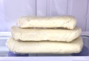 Dough wrapped in plastic wrap.