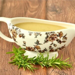 Chicken gravy in decorated gravy boat.