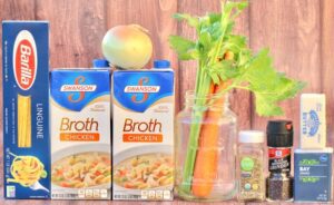 Soup ingredients including chicken broth, onion, and celery.