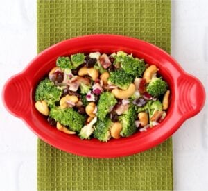 Broccoli salad in a red dish.