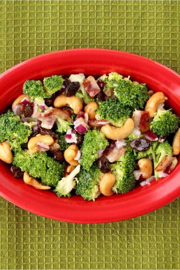 Broccoli salad in a red dish.