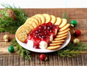 Crackers on a plate with cream cheese dip.