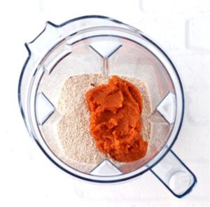 Pumpkin and dry ingredients in a blender.