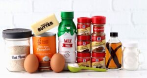 Pumpkin oatmeal pancake ingredients including milk, cinnamon, and ginger.