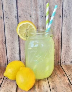 Jar of lemonade with paper straws.
