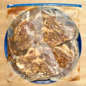 Bag of marinating steaks.