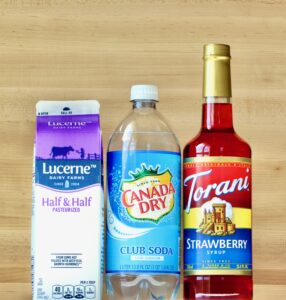 Club soda, half and half, and strawberry syrup.