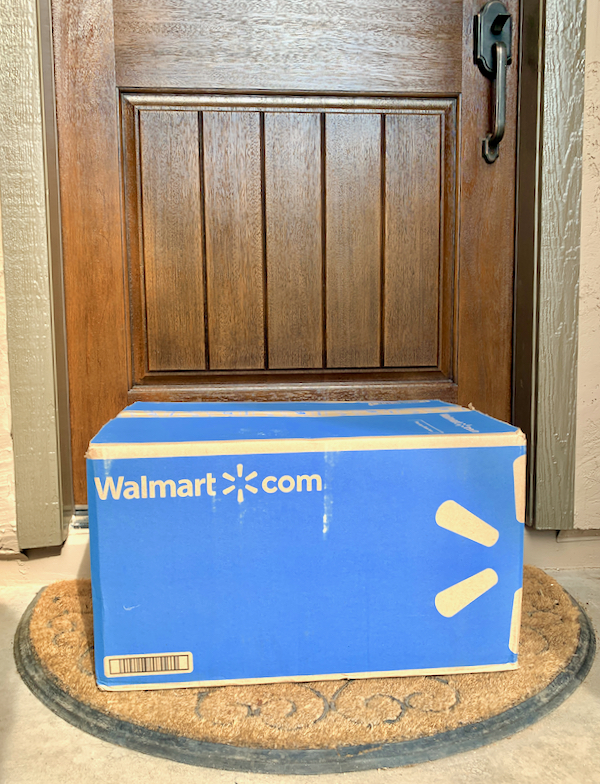 Delivered Walmart box in front of house door.