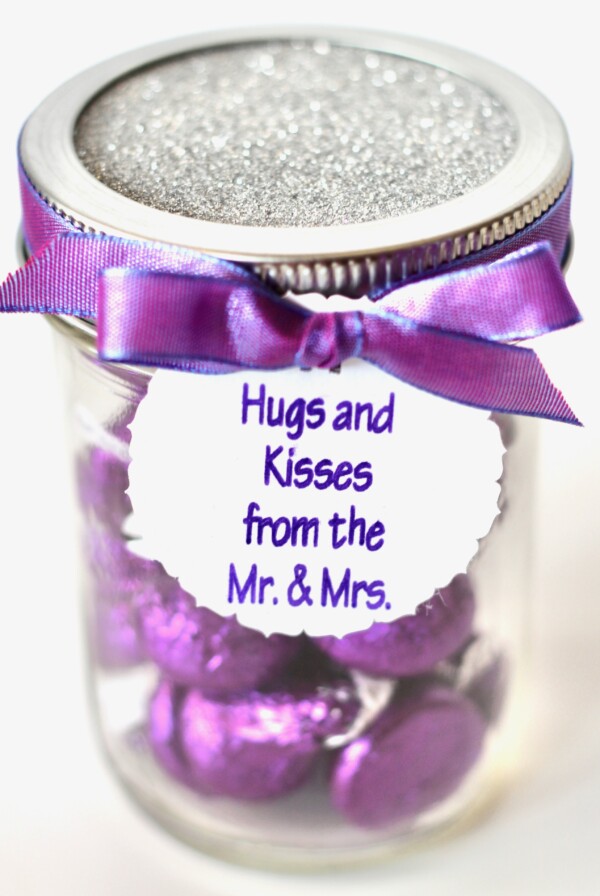 Candy in a jar labeled "Hugs and Kisses from the Mr. & Mrs."
