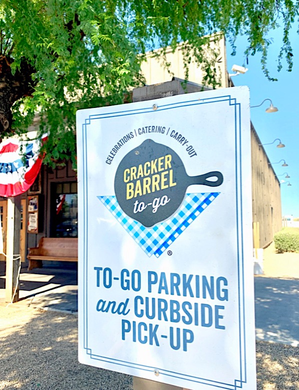 Cracker Barrel curbside pickup sign in parking lot.